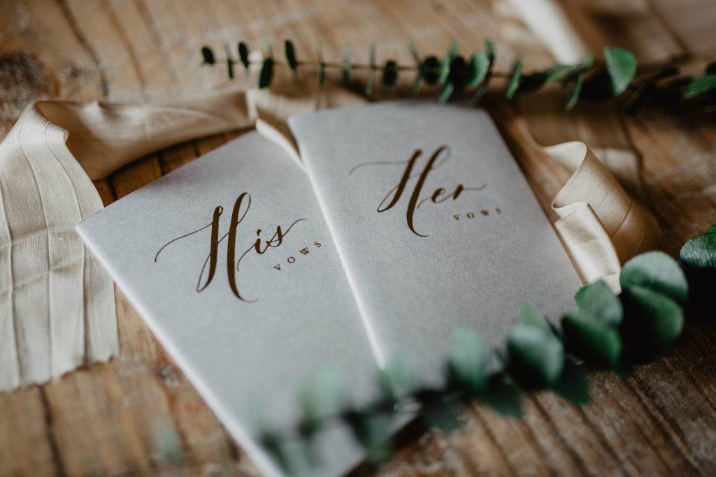 His and Her gray calligraphy vow books for bride and groom to be included in wedding day essentials kit by New York photographer Jessy Herman Photo