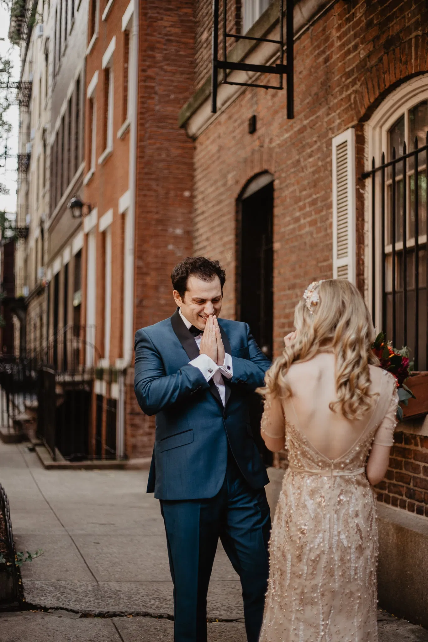 Groom looks at bride in awe during first look on their wedding day with Jessy Herman Photo