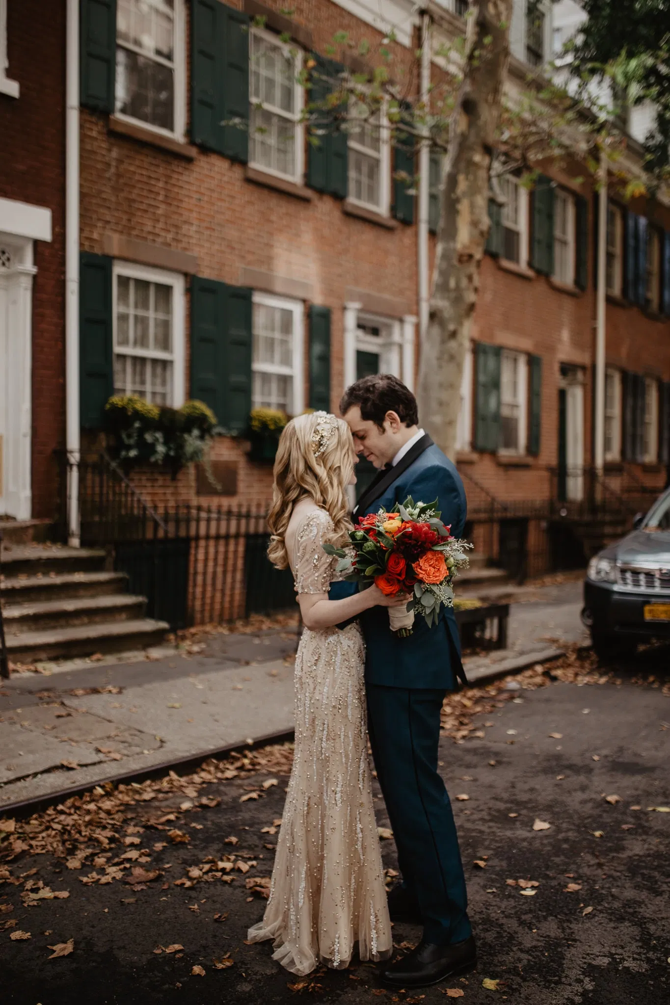 Bride and groom stand in front of brownstone in New York City during first look with Jessy Herman Photo