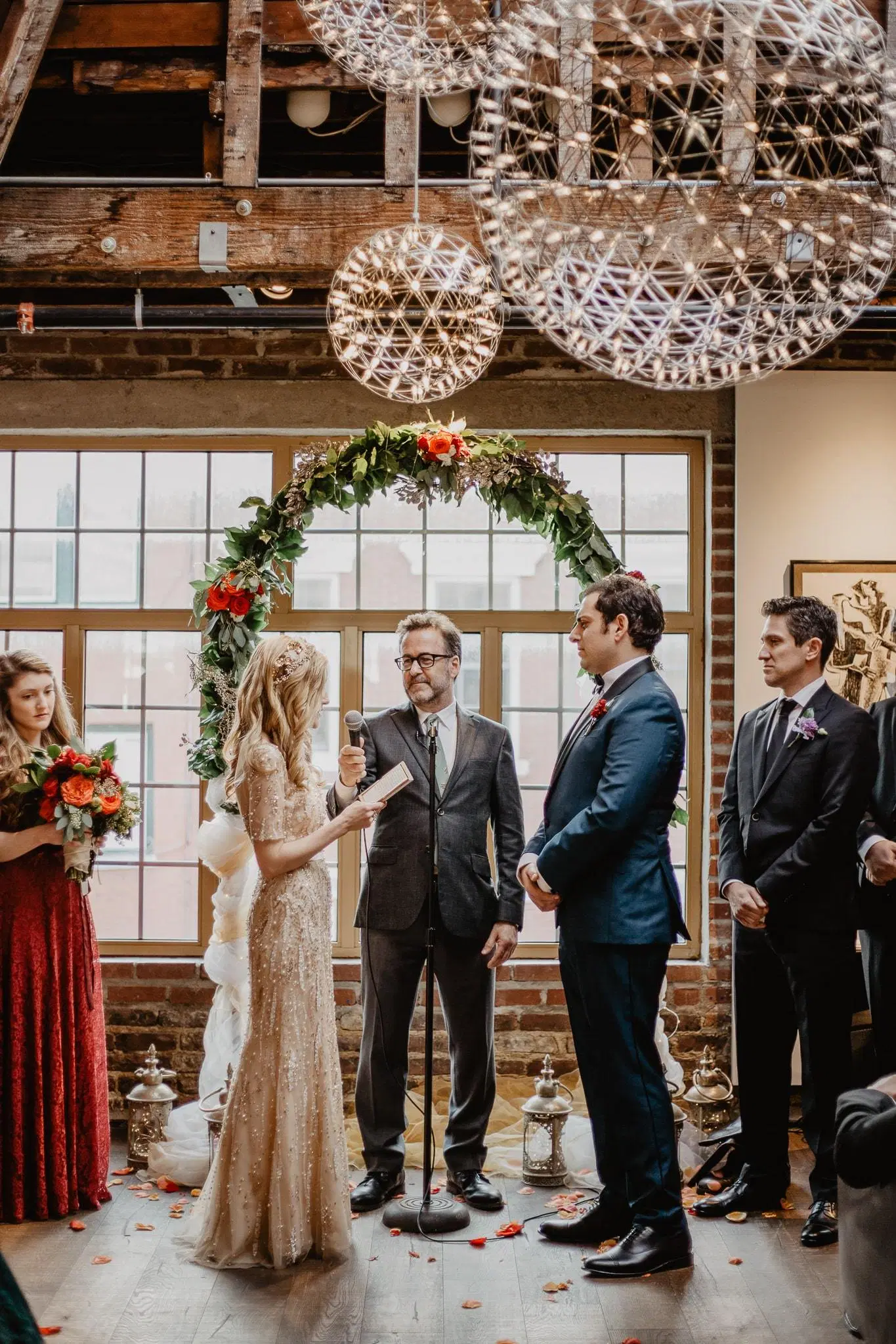 Bride and groom exchanging vows in loft wedding in nyc with Jessy herman photo