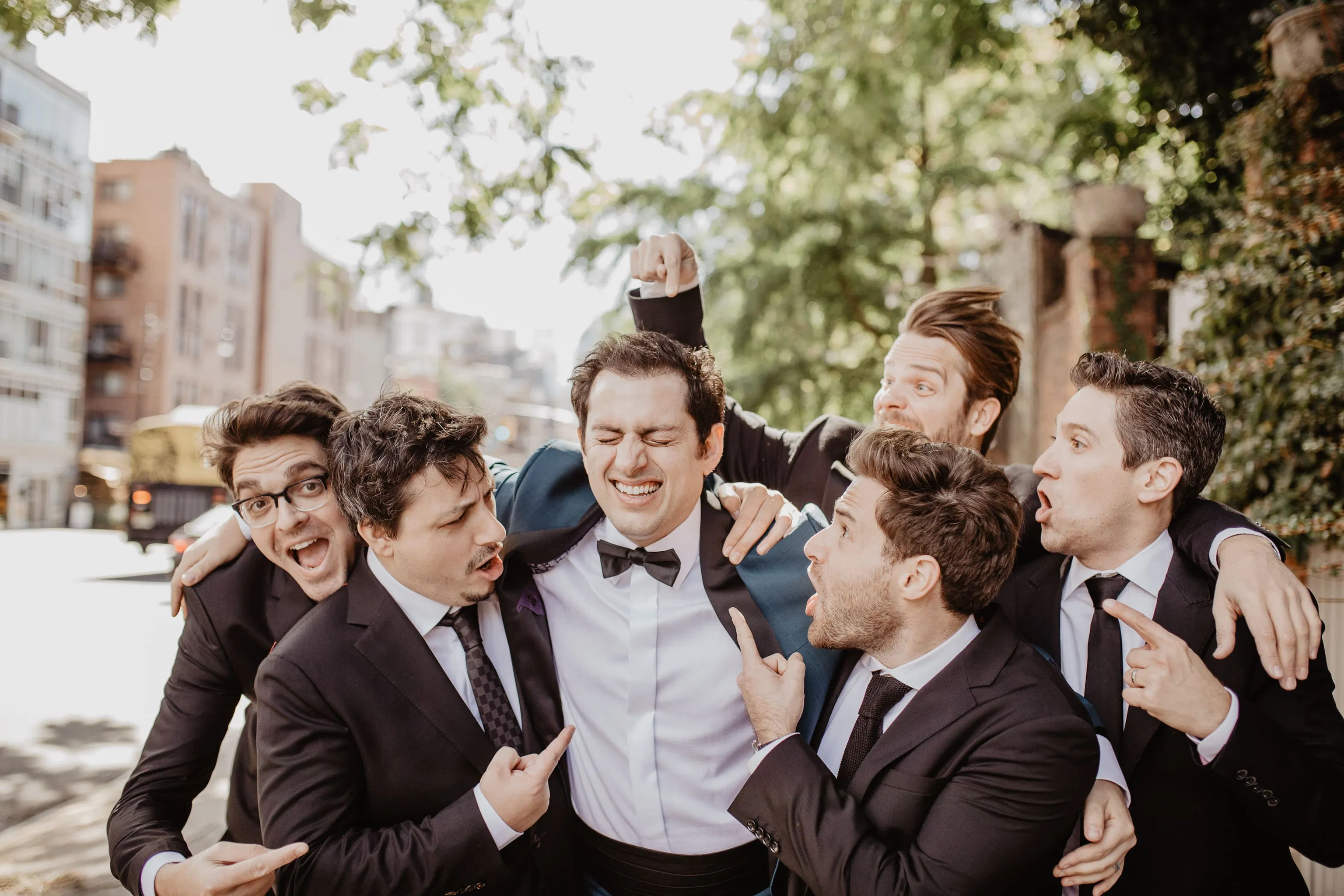 Groom and groomsmen group shot outside in NYC on wedding day by Jessy Herman Photo