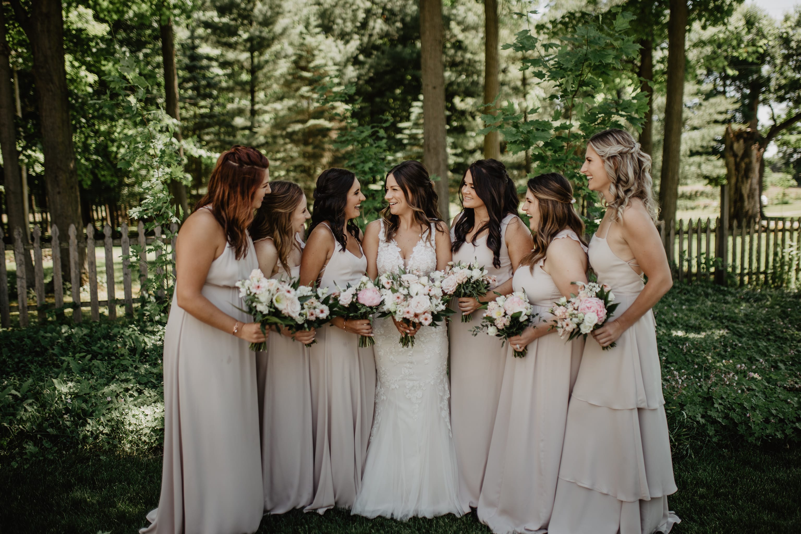 Bride with her bridesmaids in pale pink dresses