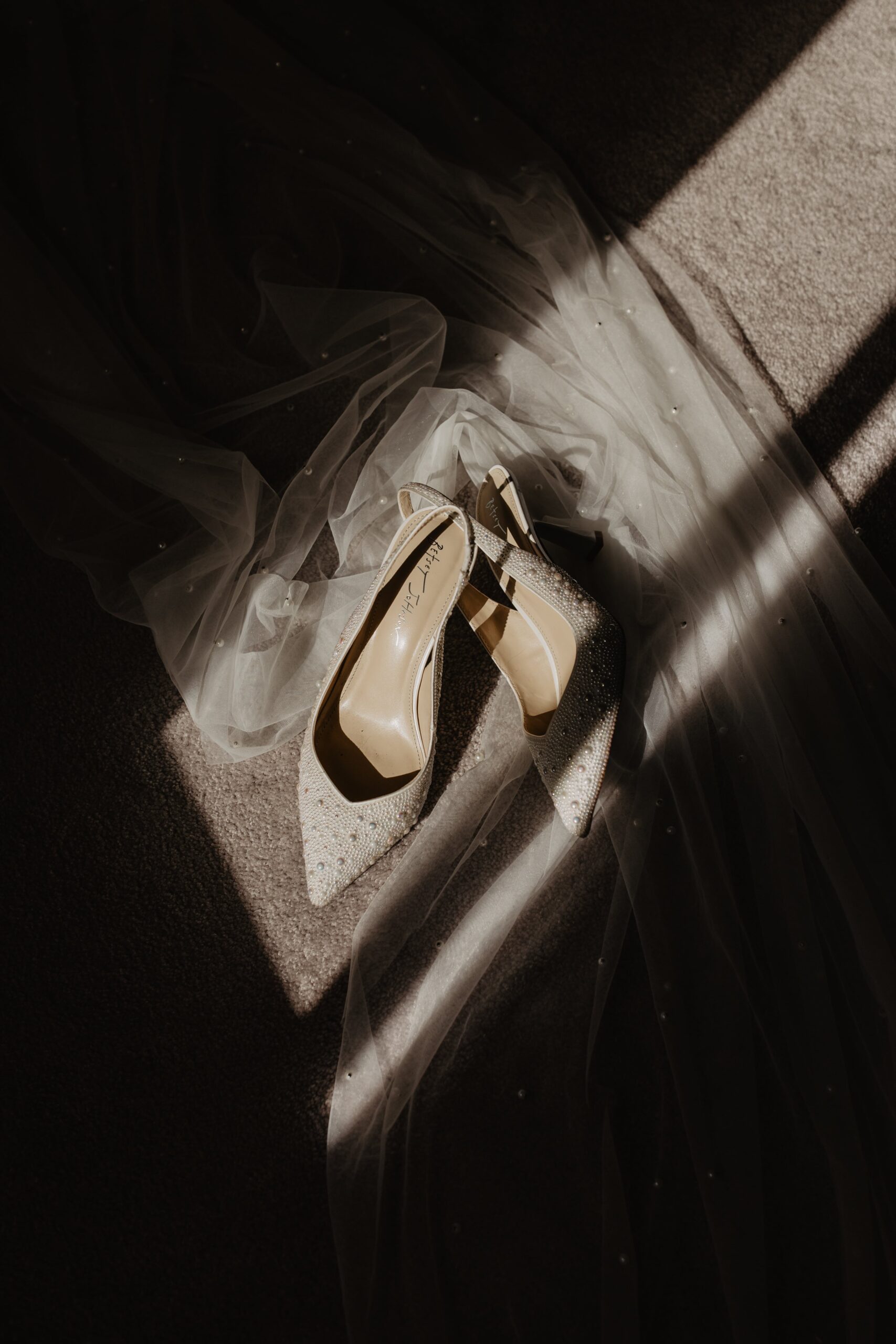 wedding shoes in a ray of light