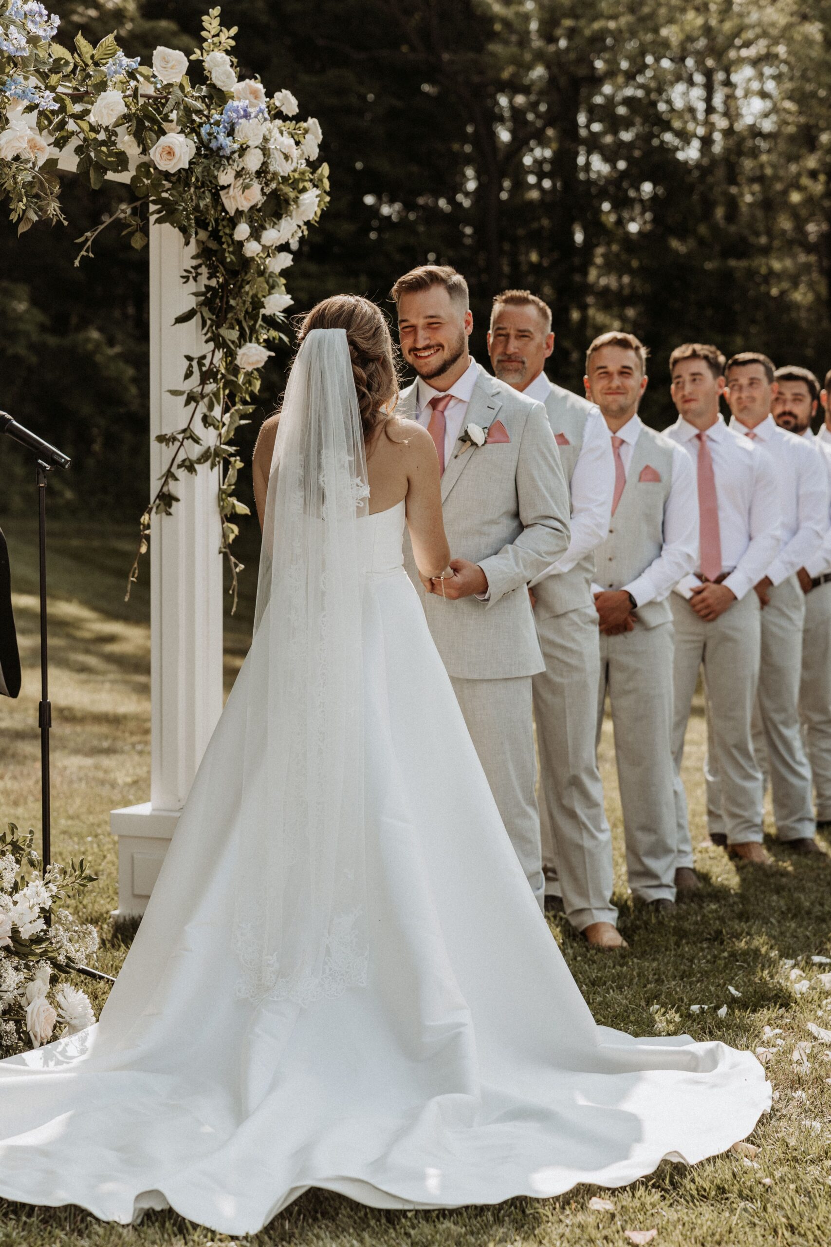 Groom smiling at bride during ceremony at Notting Hill Farm Wedding Venue